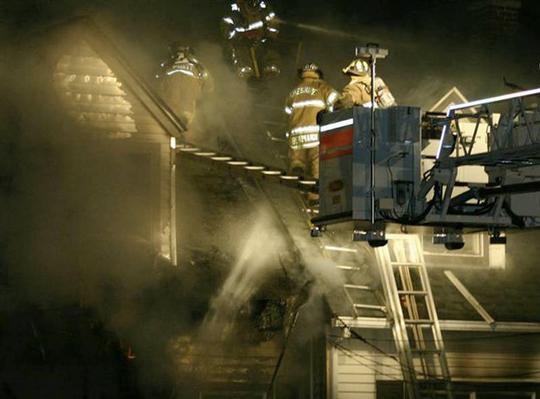 Cheshire Fire Fighters operate from Truck 2 at this fire on Sorghum Mill Road in 2006.